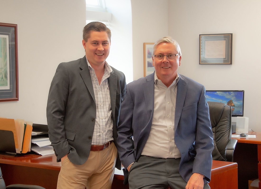 About Our Agency - The Moore Insurance Agency Team Standing Together in Their Office